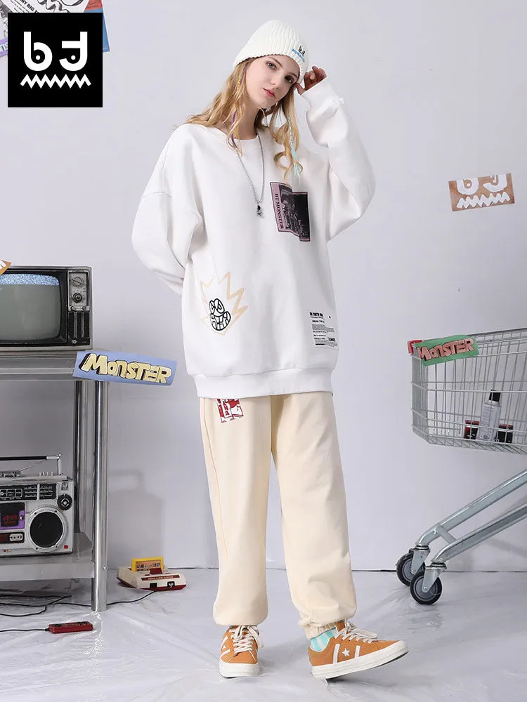 Cotton sweatpants with graffitied elastic mid-rise waist and loose legs